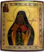 Russian Orthodox icon restoration after treatment - religious painting of bearded saint with restored gold leaf background and vibrant colors