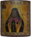 Religious icon restoration before treatment - Russian Orthodox saint painting showing age damage and surface deterioration